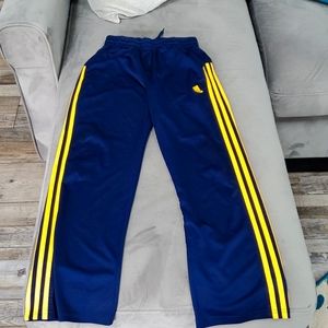 Boys adidas sweat pants.  Navy blue with yellow stripes. Size M (10-12).